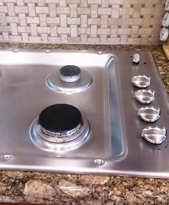 Clean stove after professional kitchen cleaning